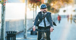 business man riding an e bike